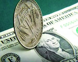 Rupee rises one paisa against US dollar