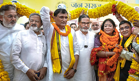 Jan Suraaj Party chief Prashant Kishor being garlanded by supporters during an election campaign meeting ahead of the Bihar Legislative Council polls, in Patna, Bihar, Tuesday, Oct. 6, 2026. (PTI Photo)