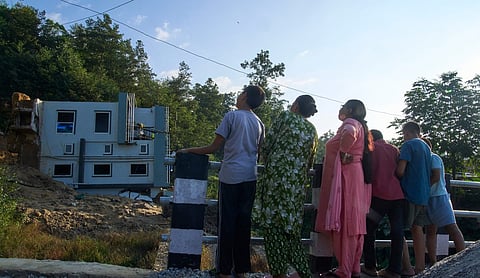 Representational image: Nepalese people watch a house that collapsed after a landslide in Lalitpur. (AP Photo via PTI)