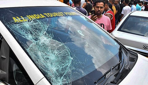 Cab operators block vehicles at Jorabat on the Assam-Meghalaya border following violence during a KSU rally in Shillong. | Image source: PTI