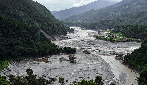 A view of damaged and half-buried buildings under silt and debris following devastating flash floods | Source: PTI