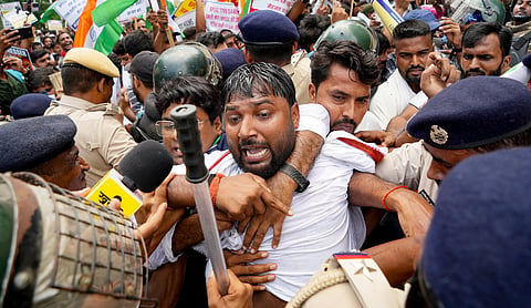 Police personnel use water cannons to disperse students protesting against alleged irregularities in recruitment examinations, in Patna, Bihar | Source: PTI