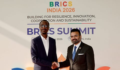 Ethiopia Foreign Affairs Minister Gedion Timothewos Hessebon, left, being received upon his arrival at Indira Gandhi International Airport, ahead of the 18th BRICS Summit, in New Delhi. (PIB via PTI Photo)