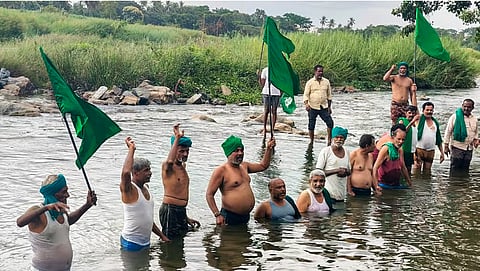 People stage a protest over the CWMA upholding the CWRC order in Karnataka | Source: PTI