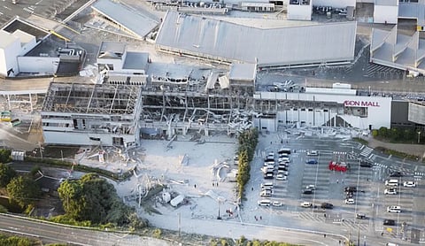 Death toll rises to 13 as rescuers search for the missing after Japan earthquake