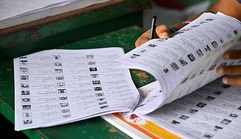 Representational image: Election officials verify entries in an electoral roll.