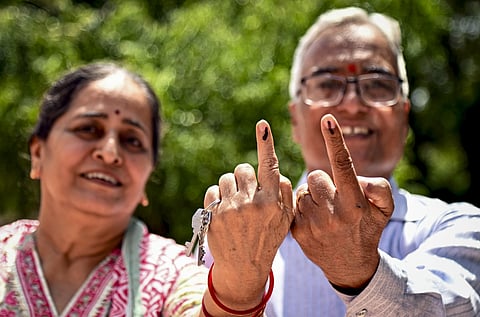 People show their ink-marked fingers after casting their votes during the Rajasthan civic polls in Bikaner, JAIPUR on Wednesday, September 9. (PTI Photo)