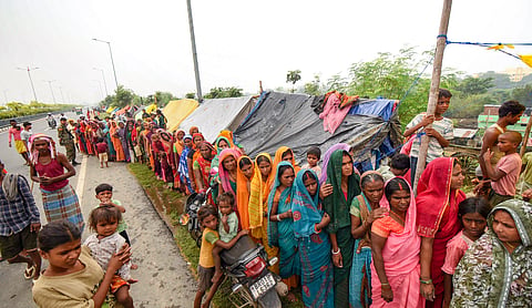 Flood victims wait in a queue for relief, in Patna, Bihar, Saturday, Sept. 5, 2026. Ganga water level breaches 'highest flood mark' at Gandhi Ghat amid heavy rain. (PTI Photo)