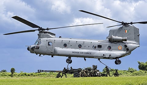 File photo: Indian Army personnel attach a howitzer to an IAF Chinook during underslung training at Panagarh, West Bengal. (@easterncomd/X via PTI Photo), NEW DELHI.