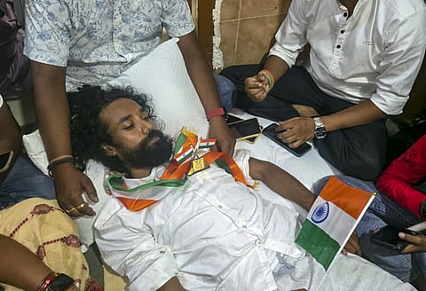 Police stopped a student from leaving the Sadar Hospital to participate in a Tiranga Yatra by protesting students on the 80th Independence Day, in Ranchi, Saturday, Aug. 15, 2026. The march, under the JPSC-JSSC Reforms Manch banner, began at the Jaipal Si
