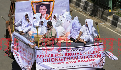 Family members perform the last rites of slain Manipuri musician Chongtham Vikram Singh in Imphal. PTI image