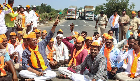Cockroach Janta Party (CJP) founder Abhijeet Dipke, centre, with Maratha quota activist Manoj Jarange Patil, left, during a meeting regarding the ongoing Maratha reservation agitation, at Antarwali Sarati, in Jalna district. PTI