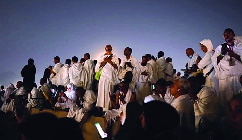 Muslim pilgrims converge on Arafat for prayers as Haj reaches its peak