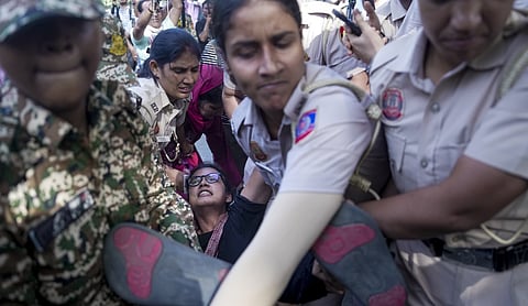 All India Students Association national president Neha Bora is detained during a protest against Chief Election Commissioner Gyanesh Kumar at Jantar Mantar in New Delhi on Saturday, October 3, 2026. (PTI Photo/Karma Bhutia)