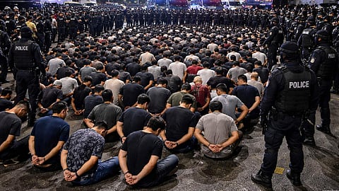 Police detain 313 in raid