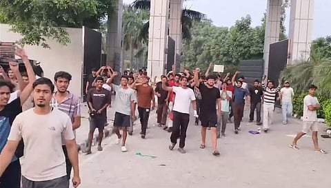 Students raise their hands as they march in a protest outside a university campus, PHAGWARA on Sunday, September 27. (PTI Photo)