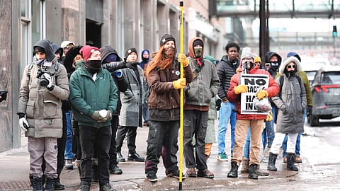 Pro and anti-ICE demonstrators face off during Minneapolis immigration