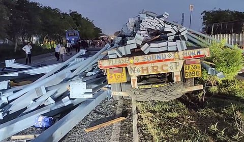 A view of the truck loaded with heavy industrial pillars that was rammed from behind by a private electric bus near Dorakunta village on the Hyderabad-Vijayawada national highway, in Suryapet district of Telangana, Wednesday, Aug. 26, 2026.