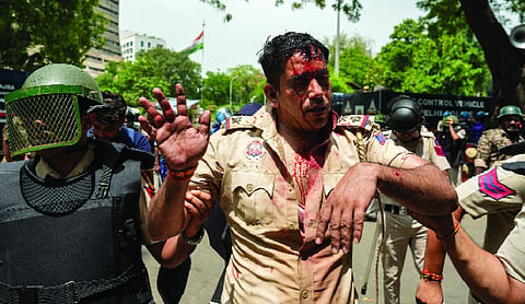 Tear gas fired, officers injured as violence erupts minutes before Pradhan’s resignation