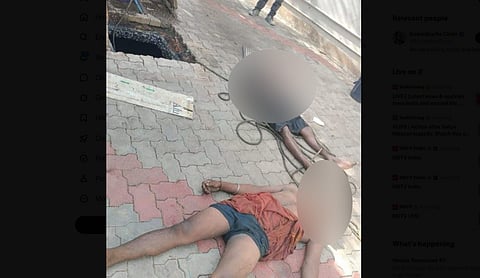 Two sanitation workers lie dead near a septic tank in Trichy district, Tamil Nadu.