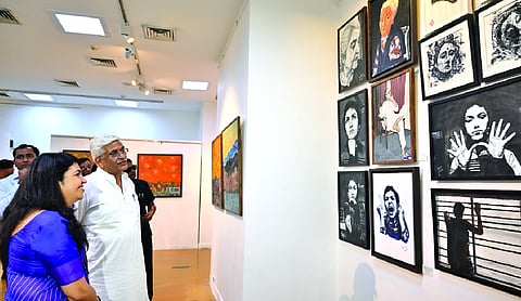 Union Cabinet Minister for Culture and Tourism Gajendra Singh Shekhawat admires the artwork alongside contemporary visual artist Aashima Mehrotra during the inauguration of her solo exhibition at the Visual Art Gallery, India Habitat Centre, New Delhi