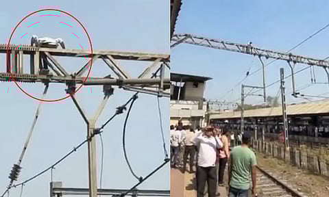 மராட்டிய மாநிலம்: மின்கம்பத்தின் மீது ஏறி வாலிபர் அட்டகாசம்... ரெயில் சேவை பாதிப்பு