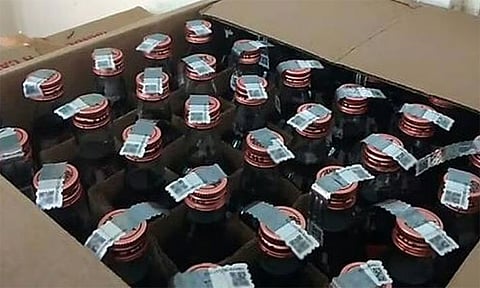 காவல் நிலையம் அருகிலேயே மது விற்ற மளிகைக் கடைக்காரர் கைது