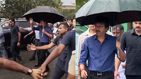 கொட்டும் மழையில் காத்திருந்த மக்கள்... ஆய்வு பணியை முடித்து குடையுடன் வந்து கையசைத்த முதல்-அமைச்சர் விஜய்