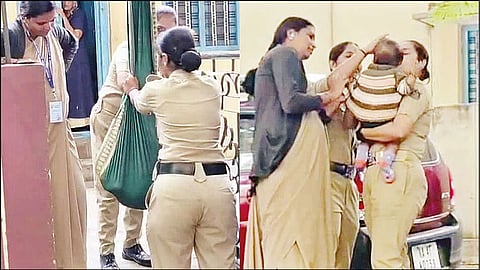 போலீஸ் தேர்வு எழுதிய தாய்... 8 மாத குழந்தையை தொட்டிலில் போட்டு தாலாட்டிய பெண் போலீசார்