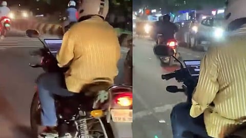 கோவை: பைக் ஓட்டிக்கொண்டே லேப்டாப்பில் வேலை பார்த்த வாலிபர் - வைரலாகும் வீடியோ