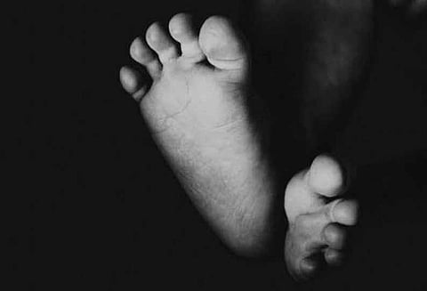 கிணற்றில் வாலிபர் பிணம் கொலையா? போலீஸ் விசாரணை