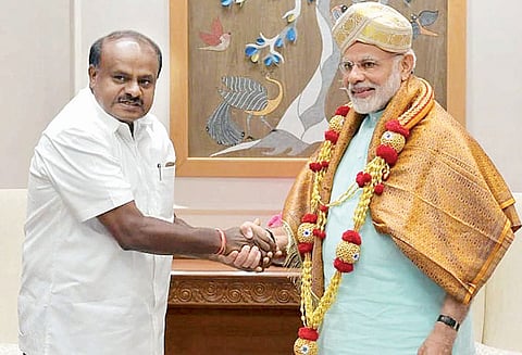 பிரதமர் மோடியுடன் குமாரசாமி சந்திப்பு கர்நாடகத்தின் வளர்ச்சி திட்டங்களுக்கு உதவும்படி கோரிக்கை