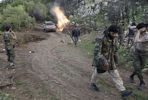 சிரியா: கிளர்ச்சியாளர்கள் குண்டுவீச்சில், படை வீரர்கள் 18 பேர் பலி