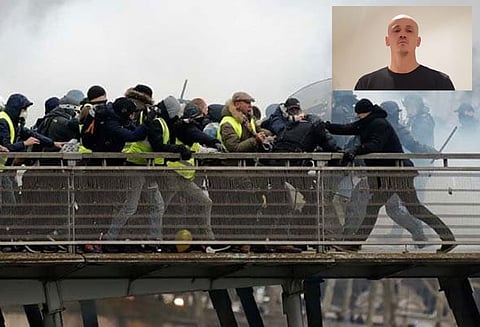 பிரான்ஸ் மஞ்சள் அங்கி போராட்டத்தில் போலீசாரை தாக்கிய குத்துச்சண்டை வீரர் சரண்