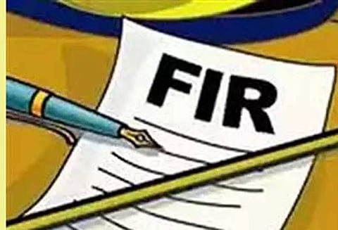 மனைவியின் படத்தை பதிவிட்டு அவதூறு; கணவர் உள்பட 2 பேர் மீது வழக்கு