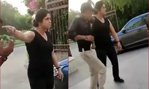 நுழைவாயில் கதவை திறக்க தாமதம்; காவலாளியை தாக்கிய பெண்