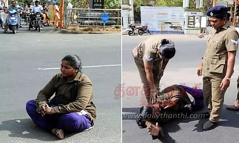 ஈரோடு கலெக்டர் அலுவலகம் முன்பு ரோட்டில் உருண்டு போராட்டம் நடத்திய பெண் ஆட்டோ டிரைவர்