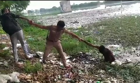 ஏரியில் இறங்கி தற்கொலை மிரட்டல் விடுத்தவரால் பரபரப்பு