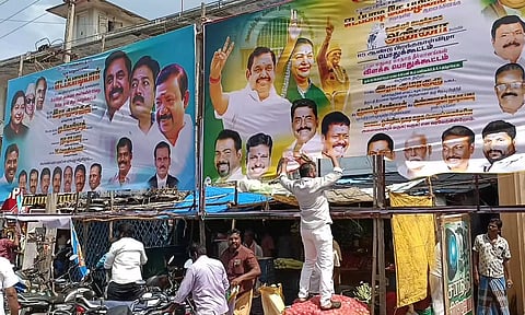 அ.தி.மு.க. பிரமுகருக்கு அடி-உதை; 20 பேனர்கள் கிழிப்பு