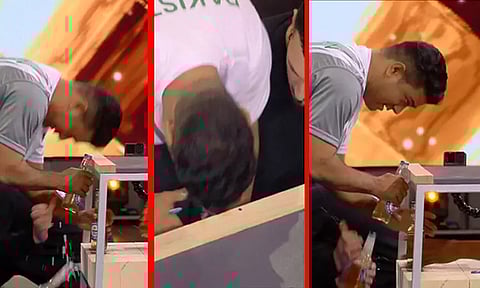 பாட்டில் மூடிகளை தலையால் திறந்து கின்னஸ் உலக சாதனை