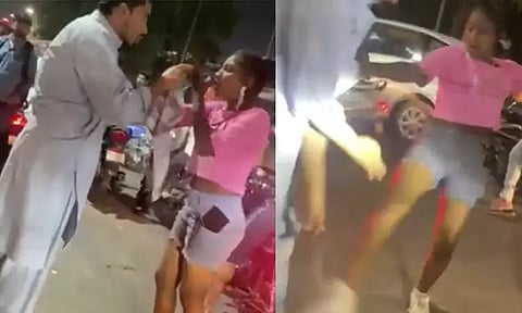 குஜராத்; பைக்கில் அமர விடாத நபர்... அடித்து, உதைத்த இளம்பெண்