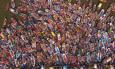 A drone shot of devotees taking a boat ride during ongoing Mahakumbh Mela, at the Sangam in Prayagraj