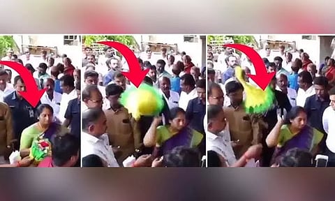 அதிகாரி கொடுத்த பூங்கொத்தை தூக்கி வீசிய மந்திரி - வைரல் வீடியோ