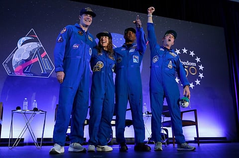 Artemis II’s moon-traveling astronauts return home to cheers after a record-breaking trip