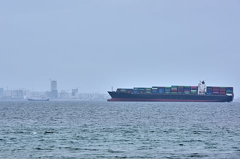 A container ship is seen in the Strait of Hormuz off the coast of Qeshm Island, Iran, Saturday, April 18, 2026. AP Photo