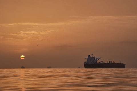 The sun rises behind tankers anchored in the Strait of Hormuz off the coast of Qeshm Island, Iran, Saturday, April 18, 2026. AP Photo