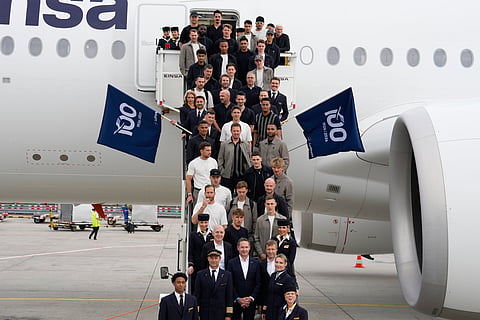 Players of German national soccer team pose on the gangway at the airport in Frankfurt, Germany, Tuesday, June 2, 2026 before they depart to the United States to prepare for the World Cup.