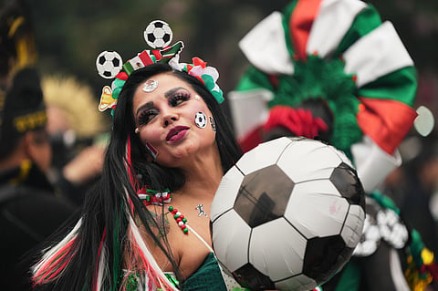 A dancer performs along Reforma Avenue in Mexico City, Saturday, June 6, 2026 ahead of the FIFA World Cup.