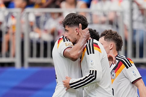 Germany's Kai Havertz celebrates with teammate Jonathan Tah, left, after scoring his side's third goal during the World Cup match against Curacao in Houston, Sunday, June 14, 2026.