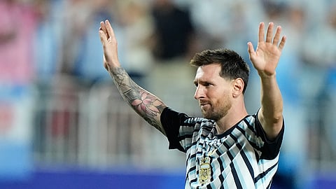 Argentina's Lionel Messi gestures to fans following the World Cup Group J match between Argentina and Algeria in Kansas City on Tuesday.